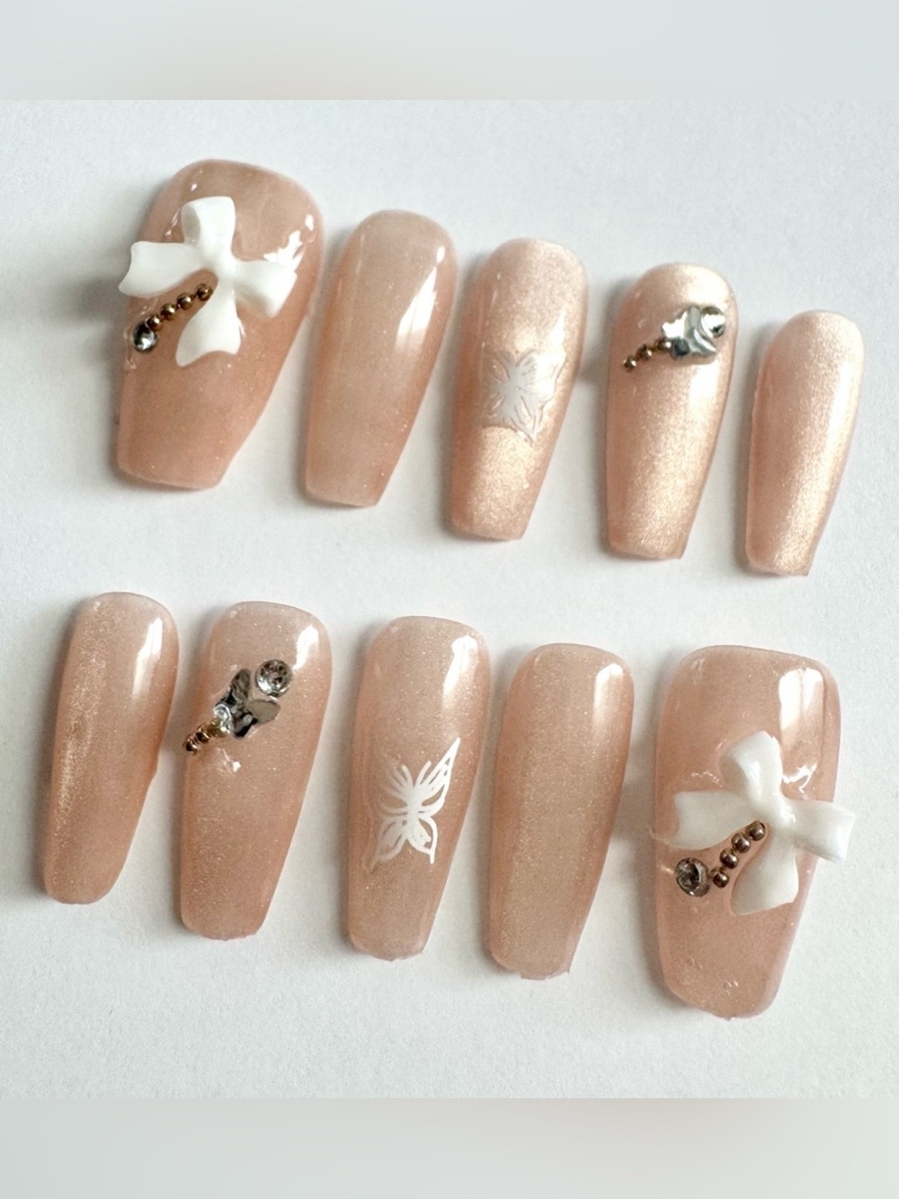 Nude Pearl Pink Press-On Nail Set with White Bow and Rhinestone Accent
